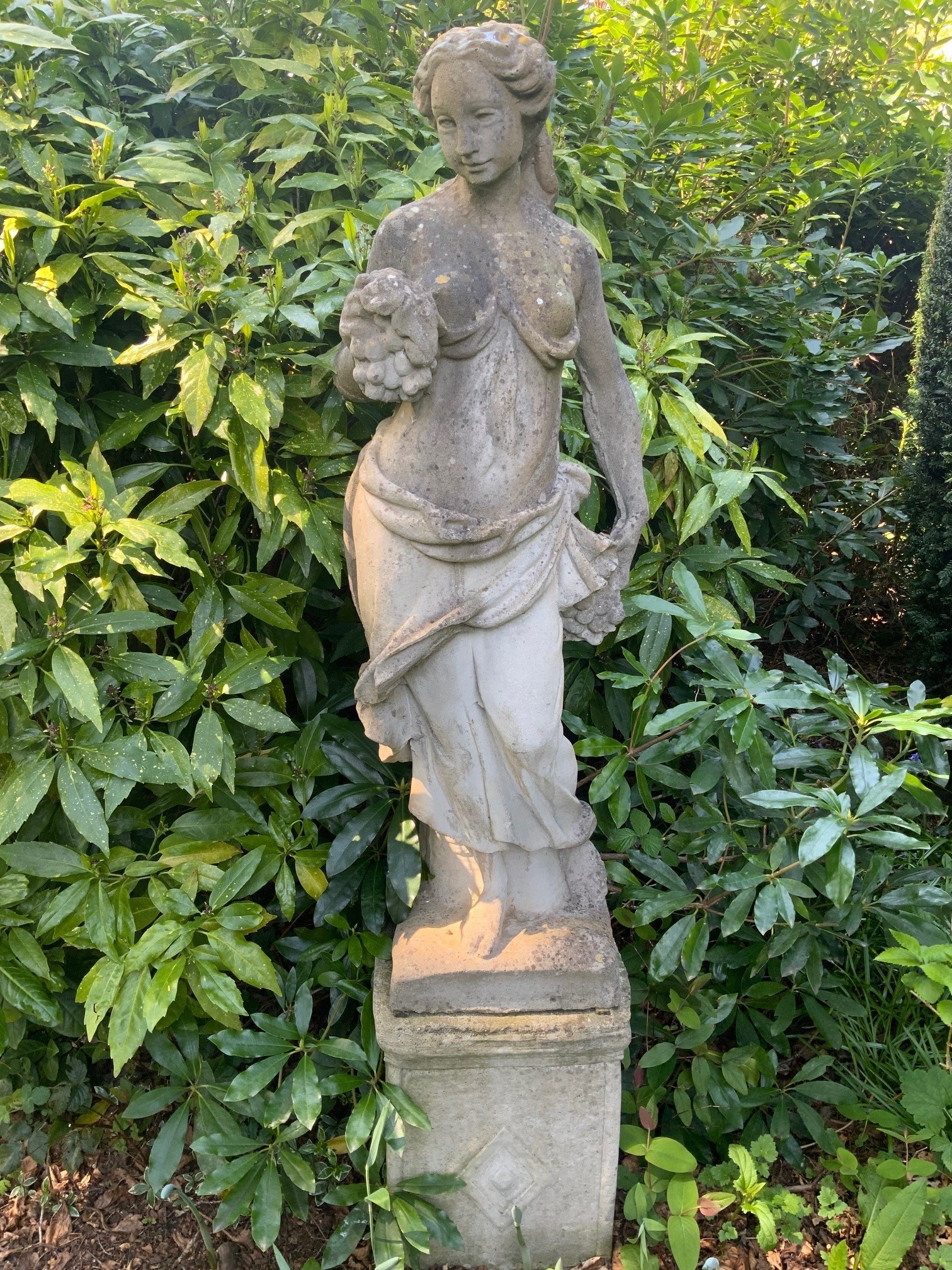 A set of four reconstituted stone garden figures, representing the Four Seasons, tallest 170cm